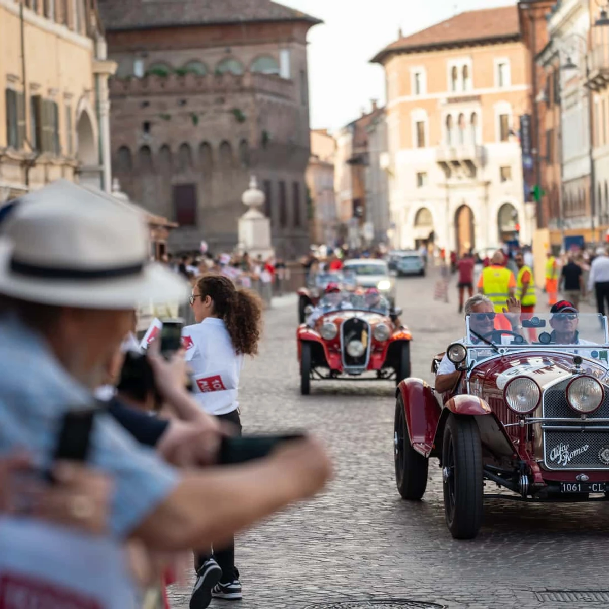 A pre-war Alfa Romeo on the cobbles of an Italian piazza during the Mille Miglia